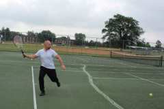 Bill playing tennis