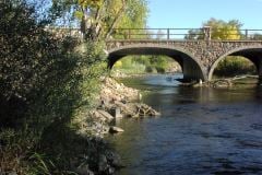 Estes Park Colorado stone bridge, river, and trees